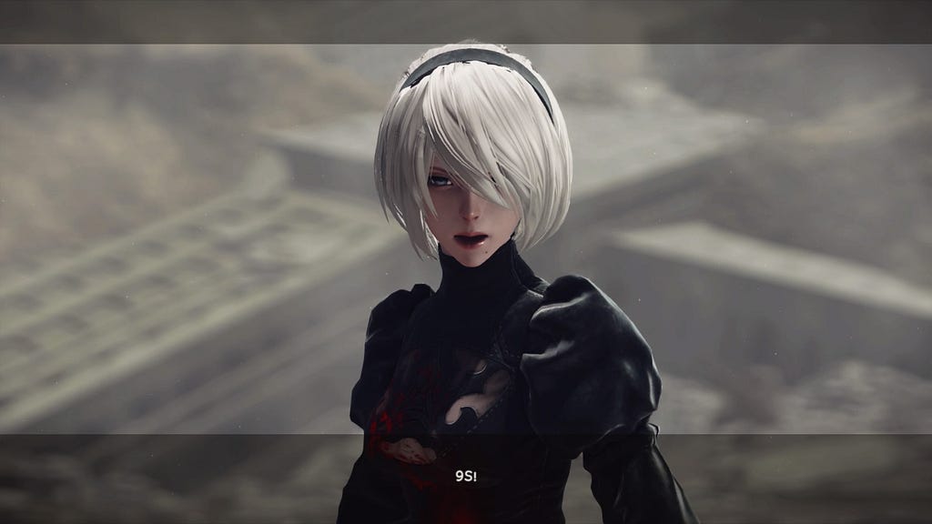 2B, without her symbolic blindfold, shouts, “9S!”