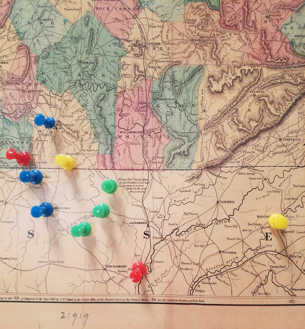 Civil War era railroad map on the TN/KY border hanging on my wall. Blues and green tacks are branches of the family on either side of the Cumberland Plateau. Red and yellow are places of significant events. Photo by author.