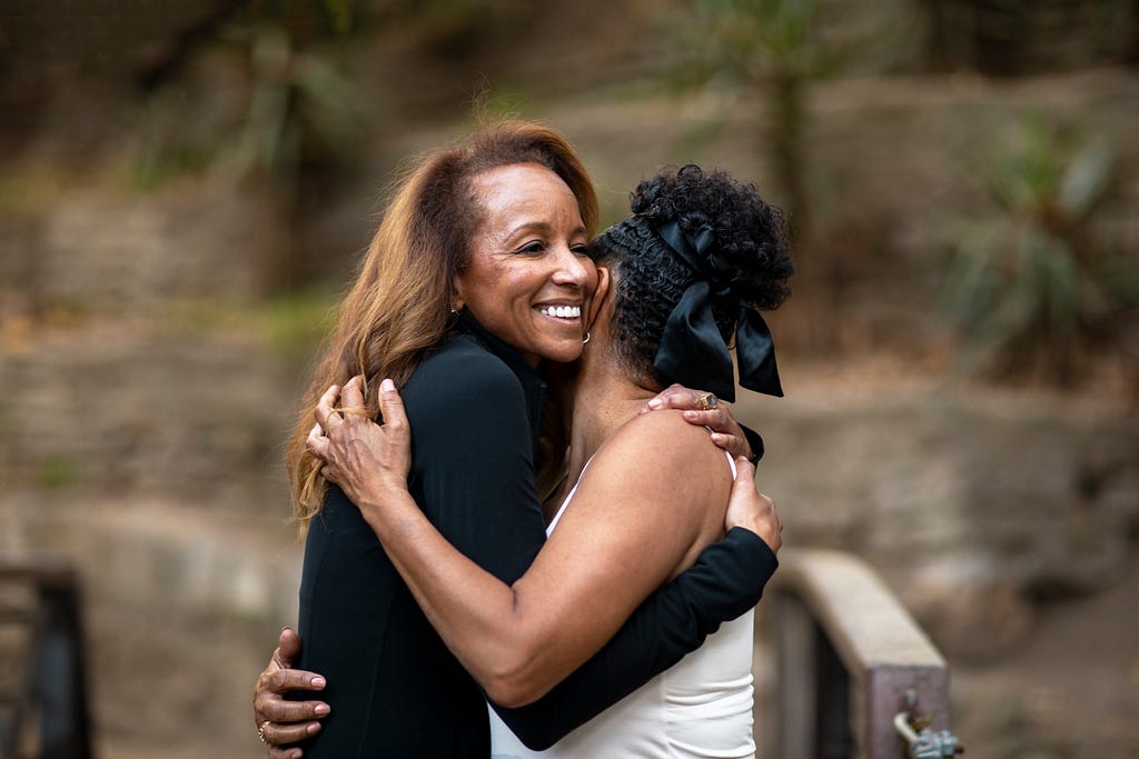 Medium shot women hugging in nature. [Image]. Retrieved from https://www.freepik.com/free-photo/medium-shot-women-hugging-nature_25175915.htm#query=POC%20women&position=7&from_view=search&track=sph