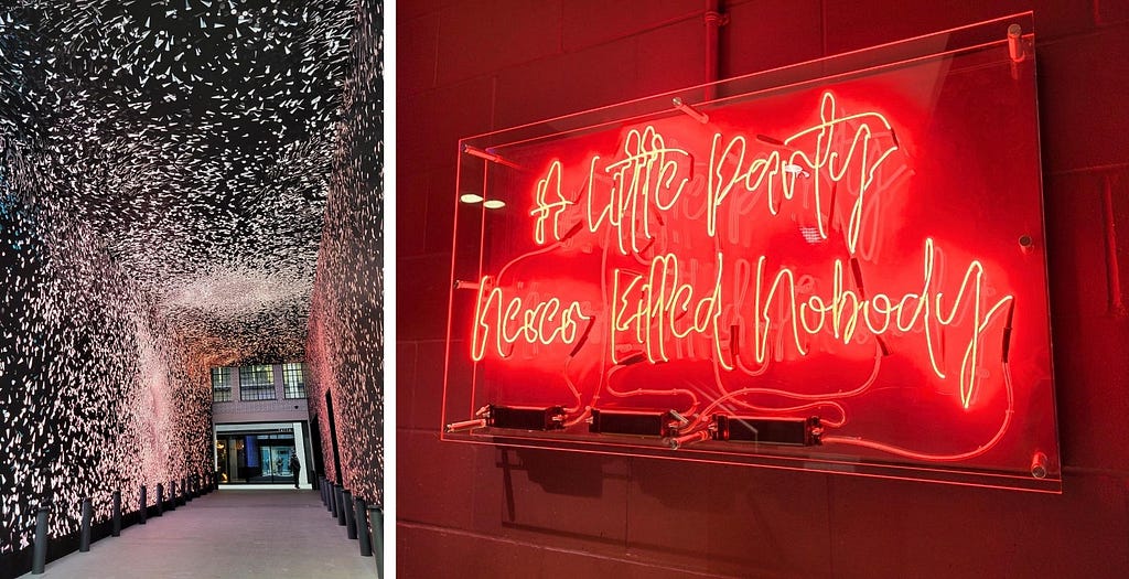 The front desk of Chateau Denmark is through the Now arcade. A neon sign inside one of the buildings. Photos by Laura Metze.