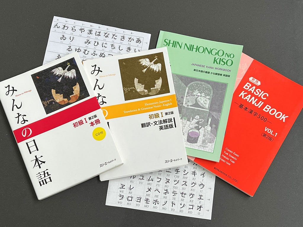 An array of textbooks and worksheets for learning Japanese.
