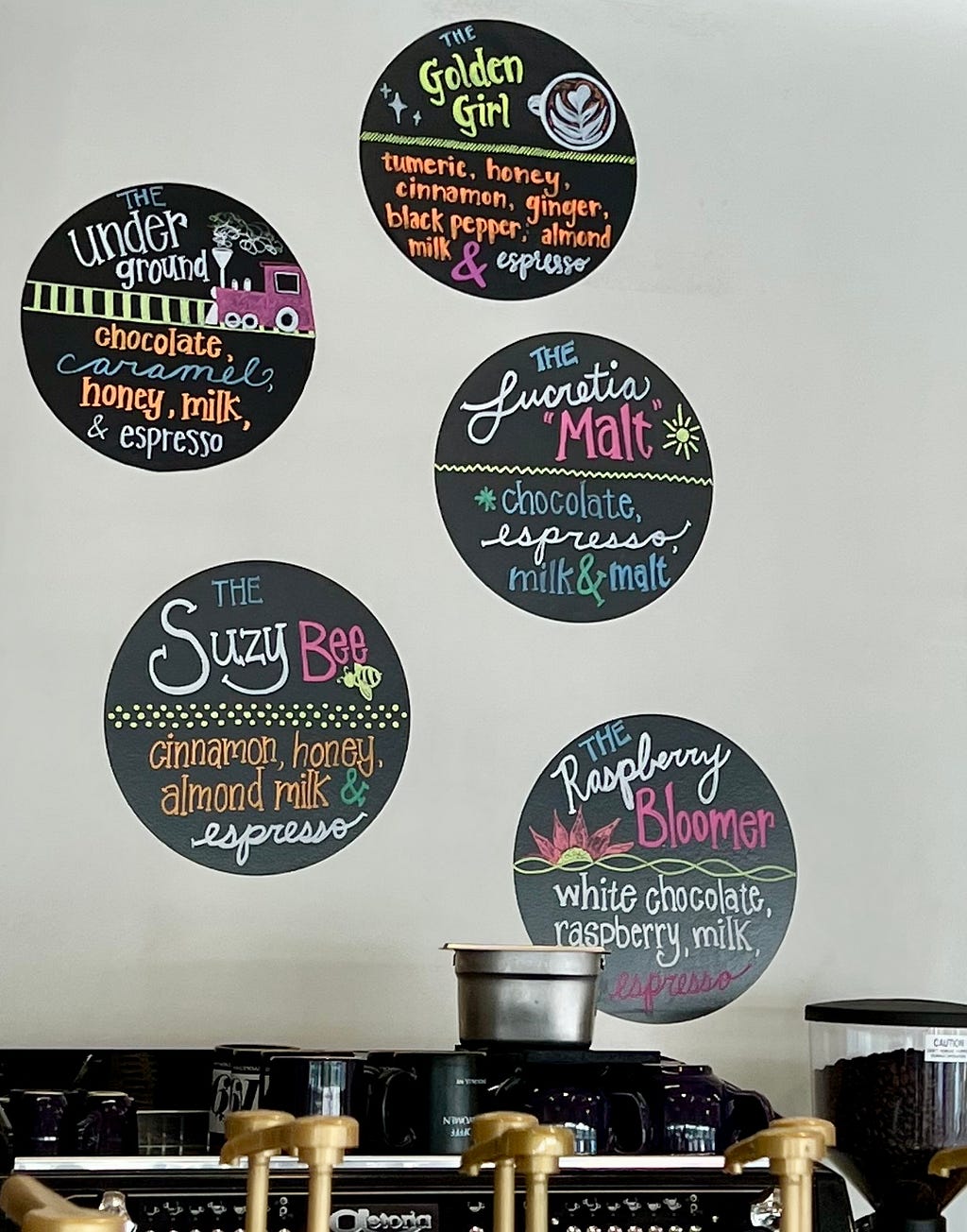 Descriptions of coffee drinks, including THE SUZEY BEE, THE RASPBERRY BLOOMER, and THE LUCRETIA MALT.