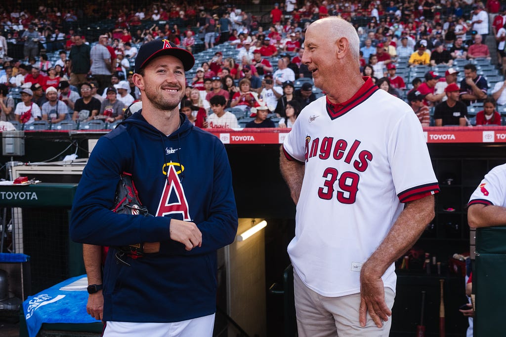 Witt chats with Angels pitcher Griffin Canning, who he previously coached.