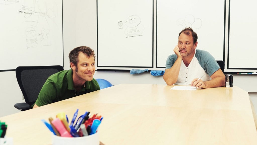 A photo of Matt Stone and Trey Parker in the South Park writers room