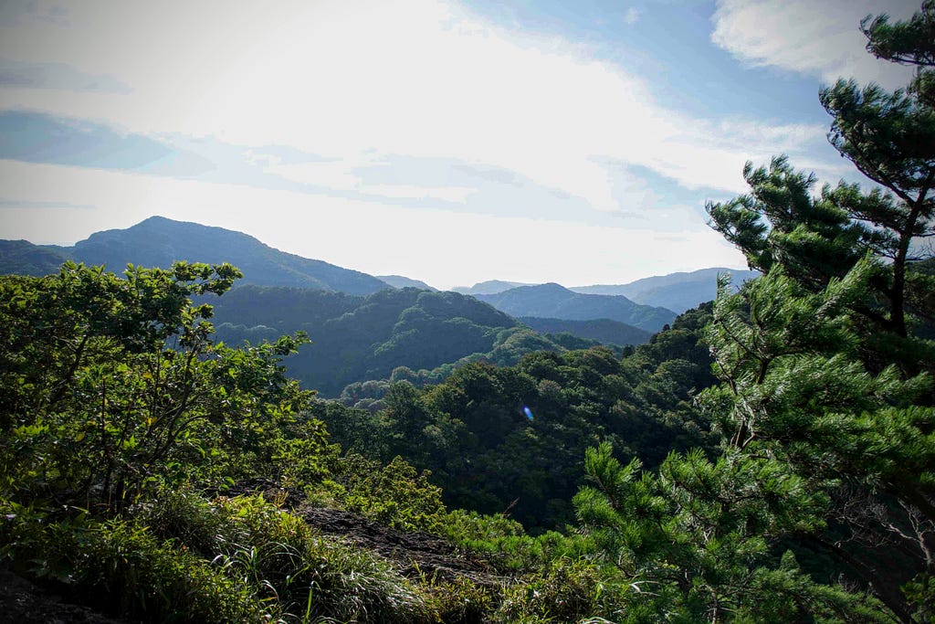 Zazen rock with an expansive view out over the surrounding mountain range on Mt. Kyogakura, one of the 100 Famous Mountains of Yamagata in Sakata City, North Japan.