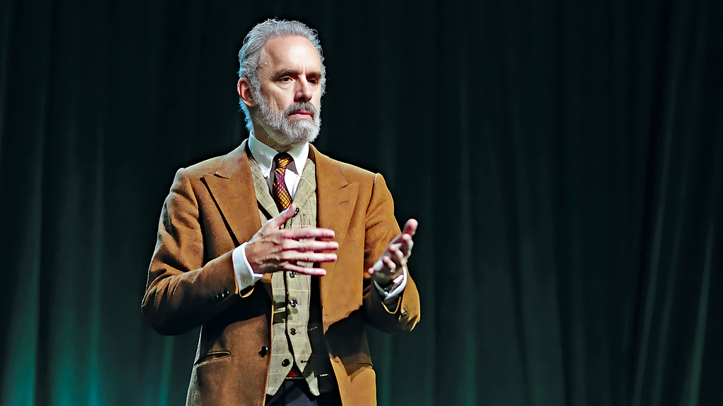 Dr. Jordan B. Peterson, a sought-after speaker on global stages, captivating audiences with wisdom.