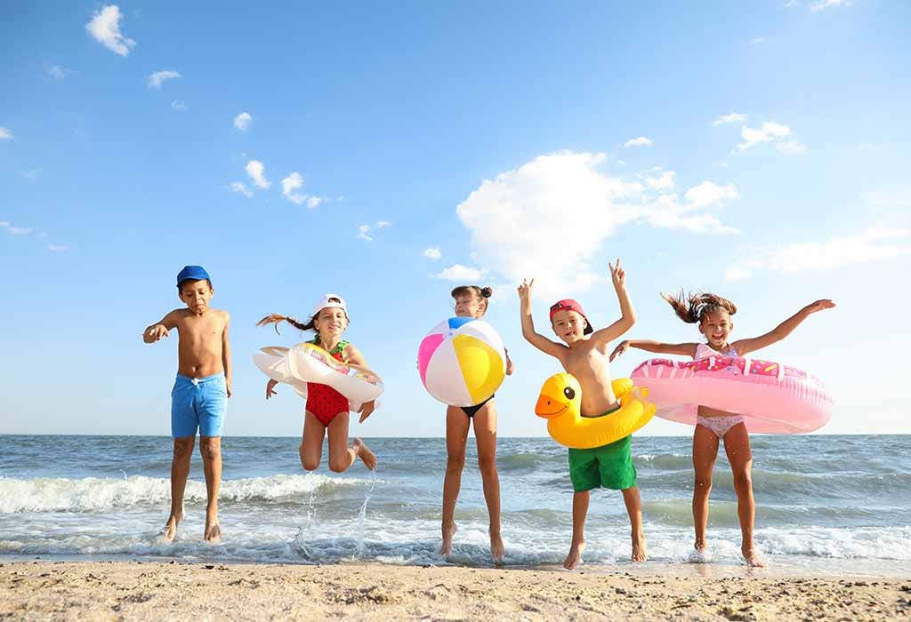 kids are enjoying summer vacation on the beach.