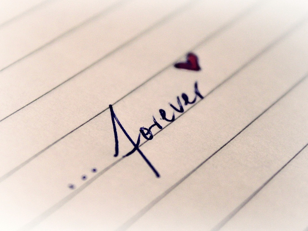 image of lined paper with the word … forever written on it with a red heart next to the word forever