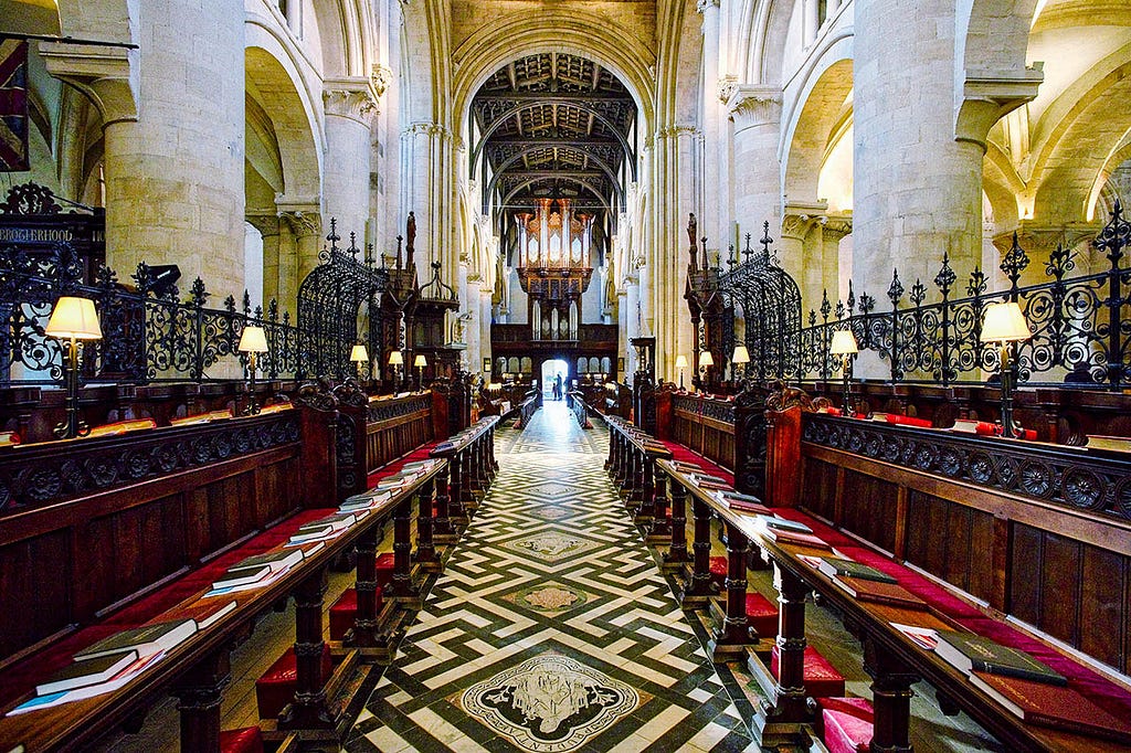 interior of gothic style church with red accented seating