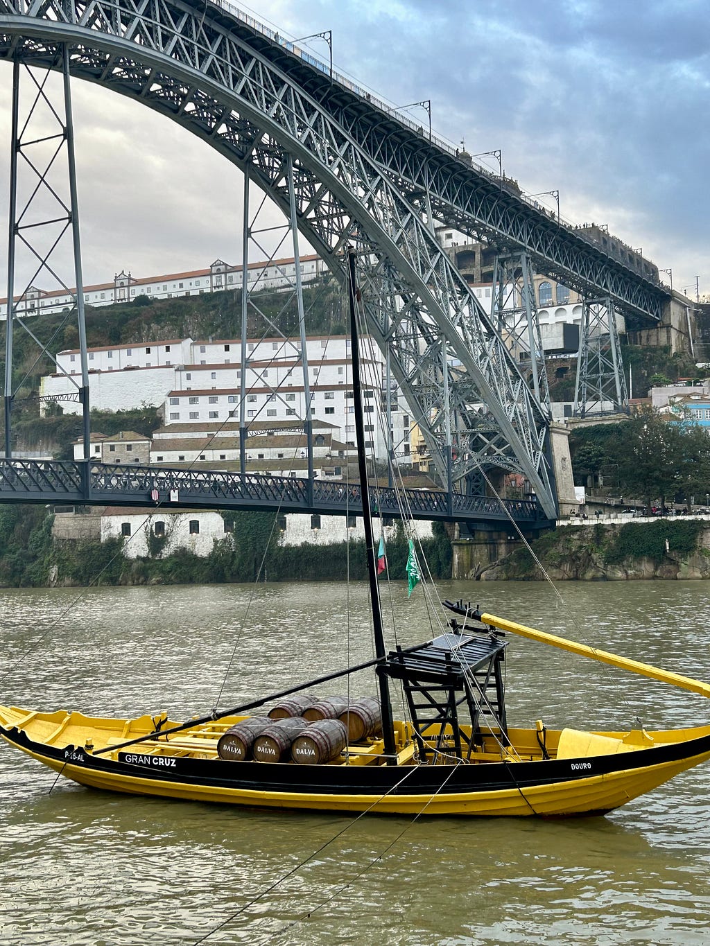 Porto, Luis I bridge and the Douro river with a barge