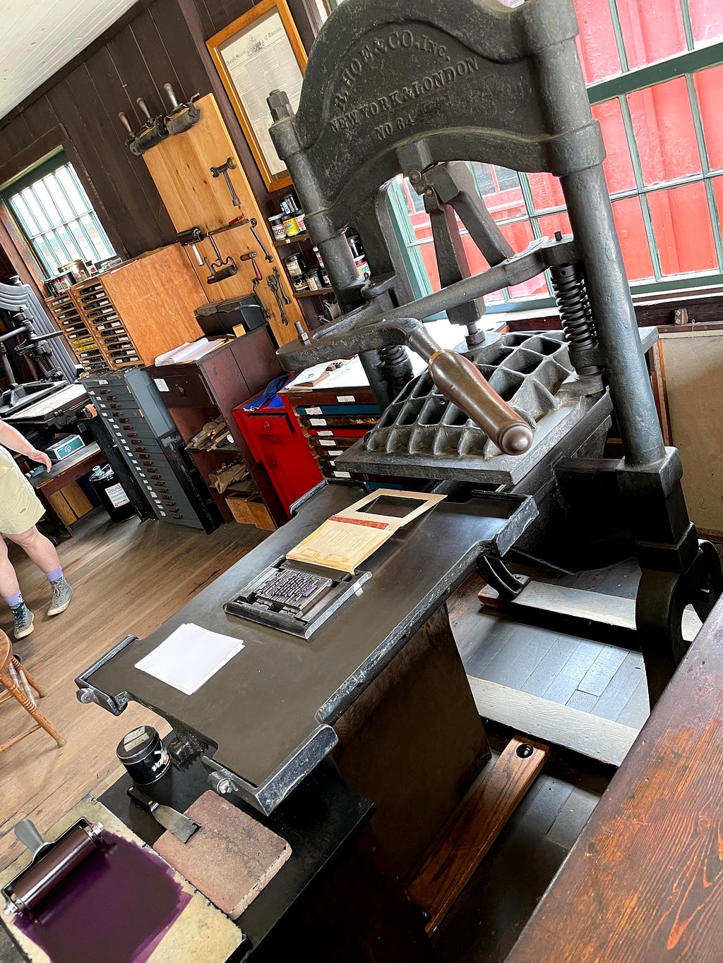 The Washington press with movable tray, movable type, sample pages, and a stamper.