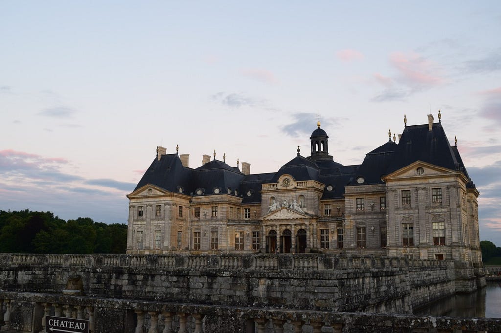 A summer evening at the Château de Vaux-le-Vicomte, seen here with its moat.