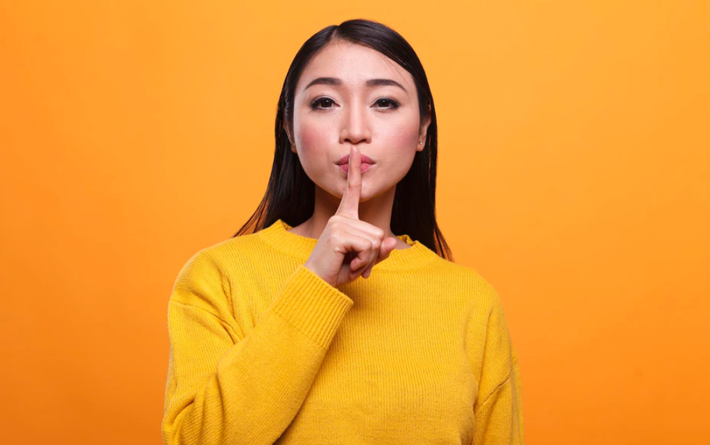 An Asian woman shushing you. #hackers #hacking #cybersecurity #awareness #passwords #passwordmanager 11 Tips to Avoid Getting Hacked — by Jonse Teopiz