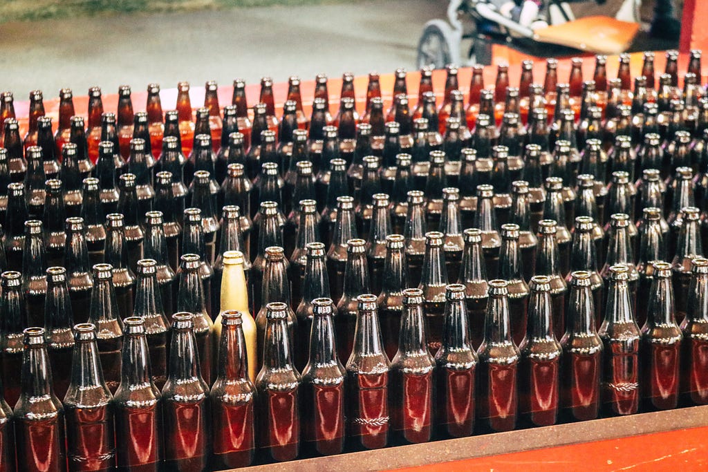 Going against the grain — one bottle stands alone amongst all the others in a production line