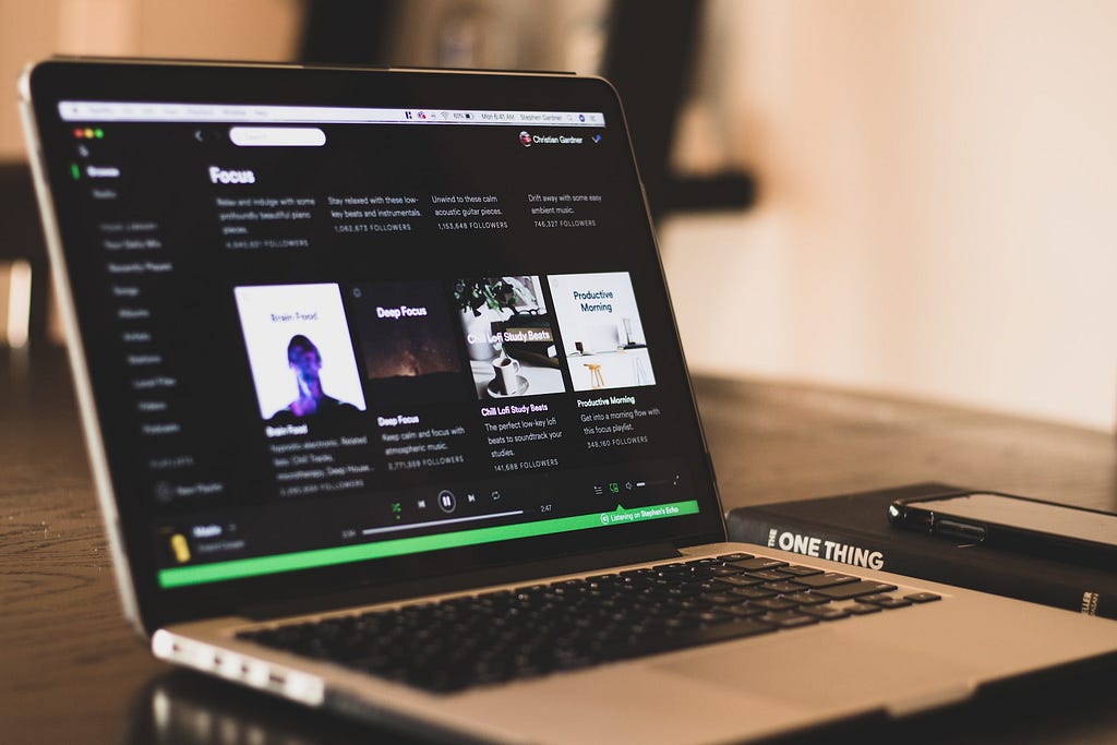 A macbook with the Spotify app opened.