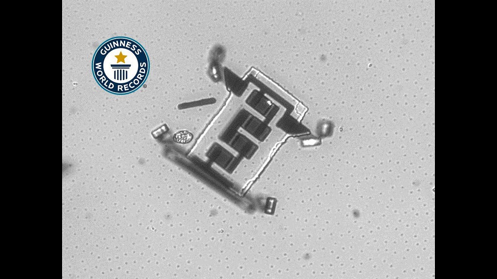 A microscopic image of OptoBot, the 2020 Guinness World Records smallest walking robot measuring 40–70 x 40 x 5 μm.