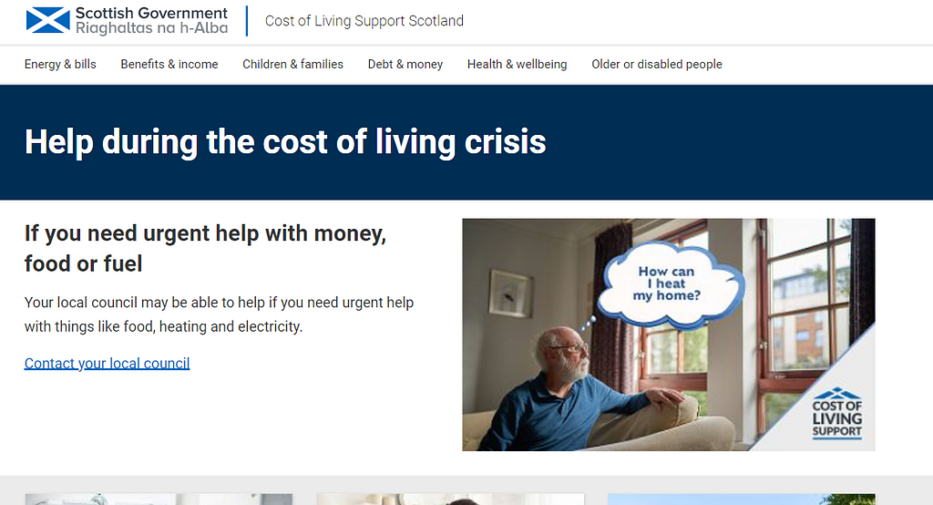 A screenshot of the Scottish Government’s cost of living support campaign website. The screenshot shows the site name ‘Cost of Living Support Scotland’, a header with information about requesting urgent support if people are struggling, and an image of a white man in a blue top with a superimposed thought bubble which reads ‘How can I heat my home’.