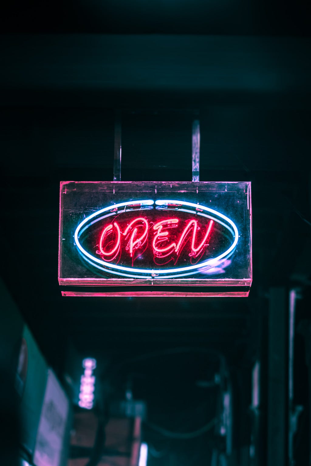 ‘Open’ sign in neon red and blue.