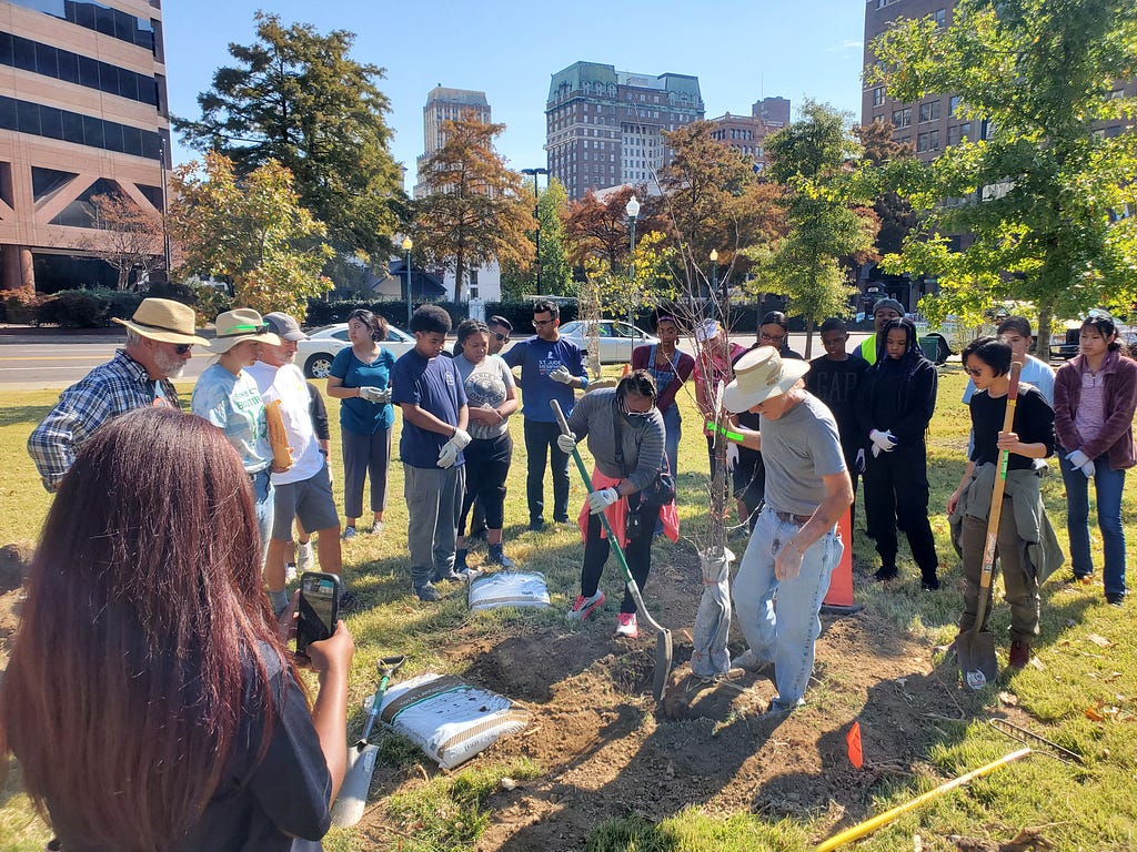 Community tree-planting on the Memphis Riverfront.