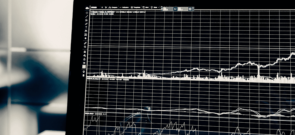 Black and white photo of a computer screen with charts and graphs