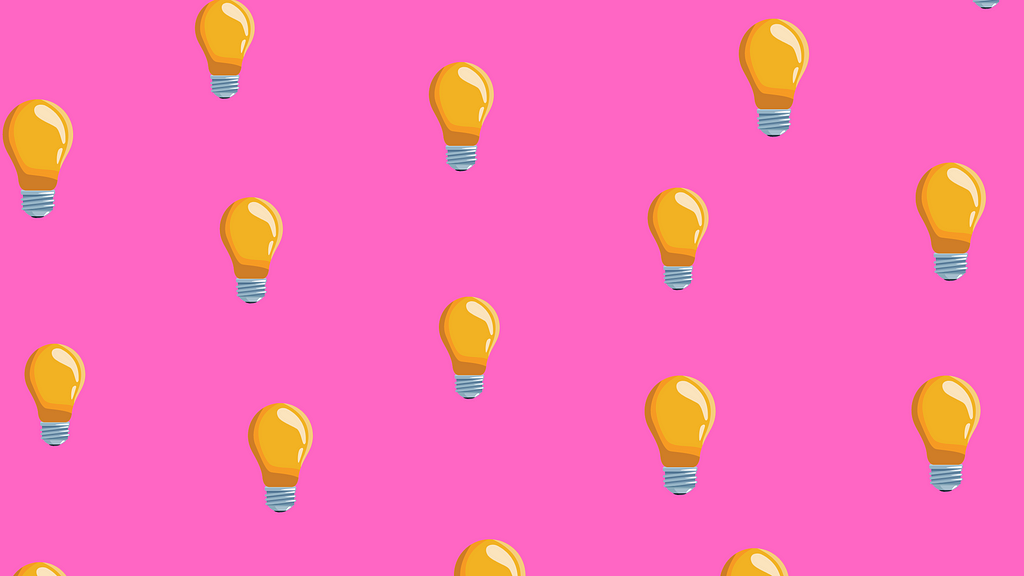 Lightbulbs on top of a bright pink background