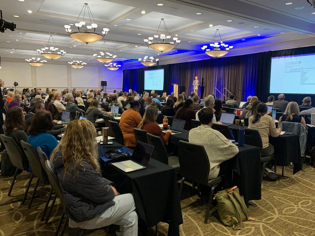 A medical professional speaking at a pediatric conference.