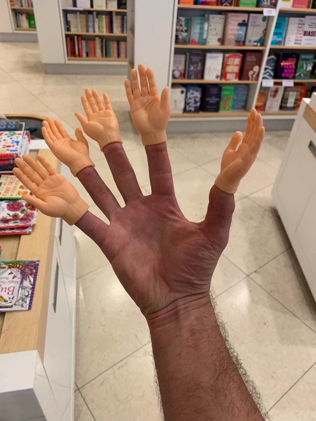 The authors hand. The tip of each finger has a small rubber hand on.