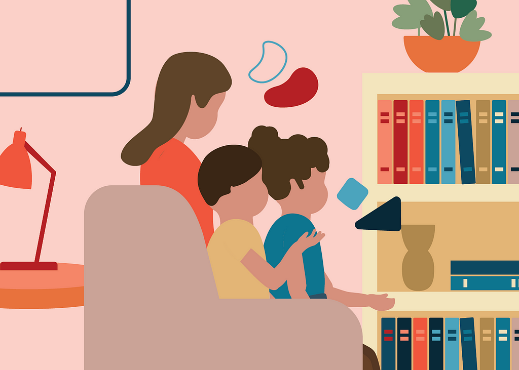 A mom and two kids sitting in front of a bookcase.