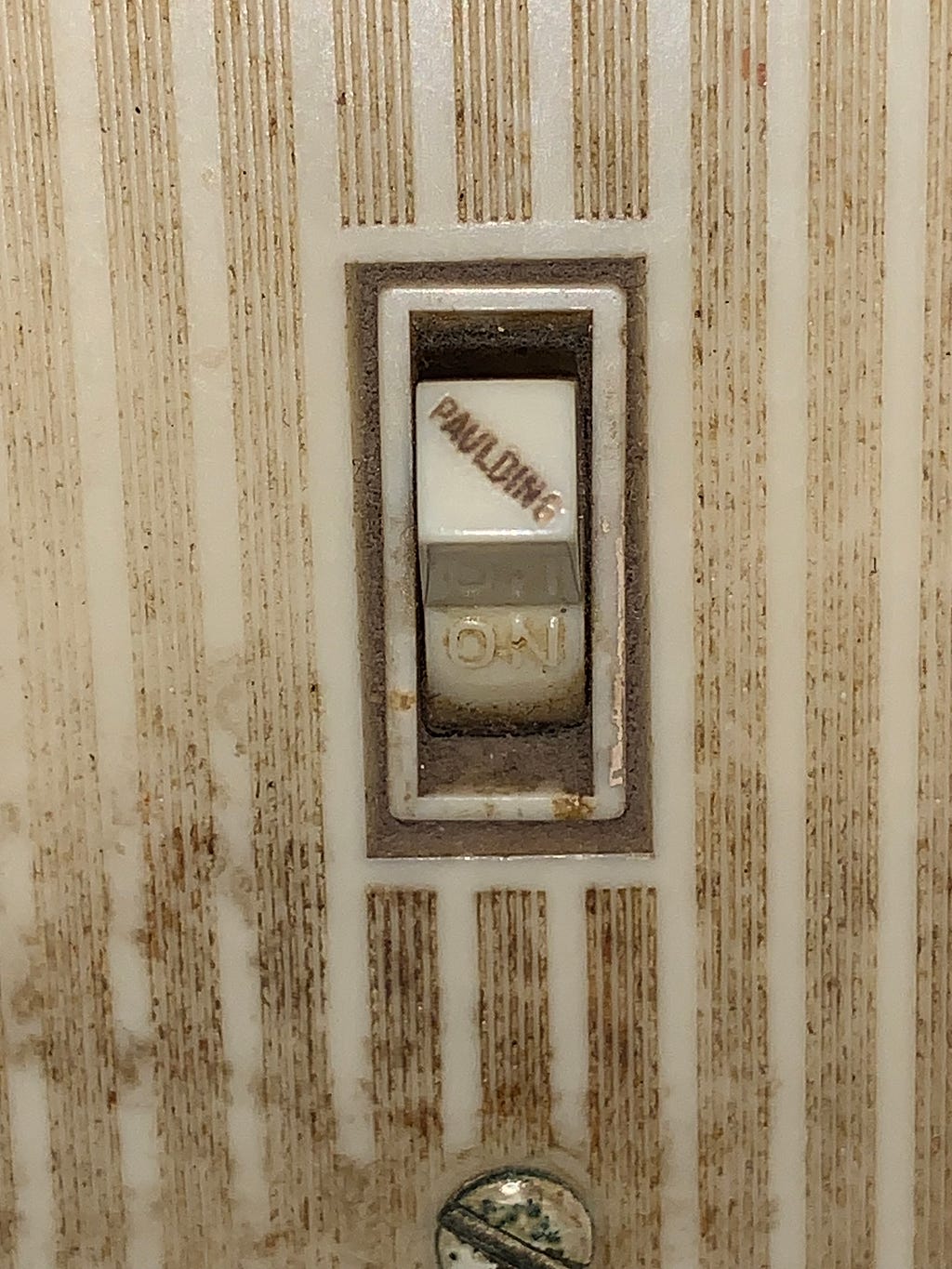 A light switch flipped to the “ON” position.