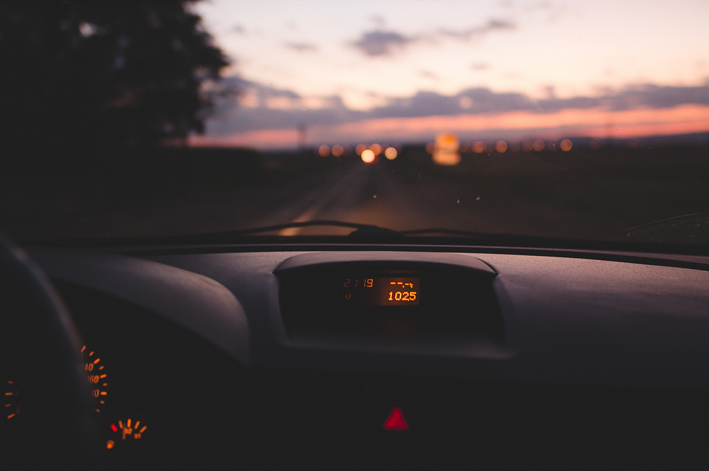 Car dashboard captured in a sunset.