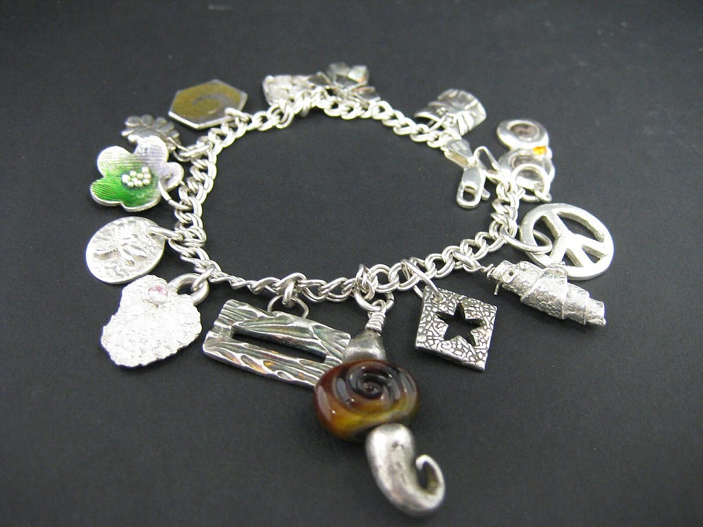 silver bracelet with charms attached