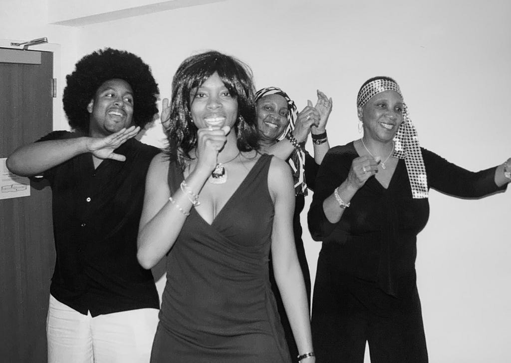 a family of four acting as tina turner, ike and the ikettes