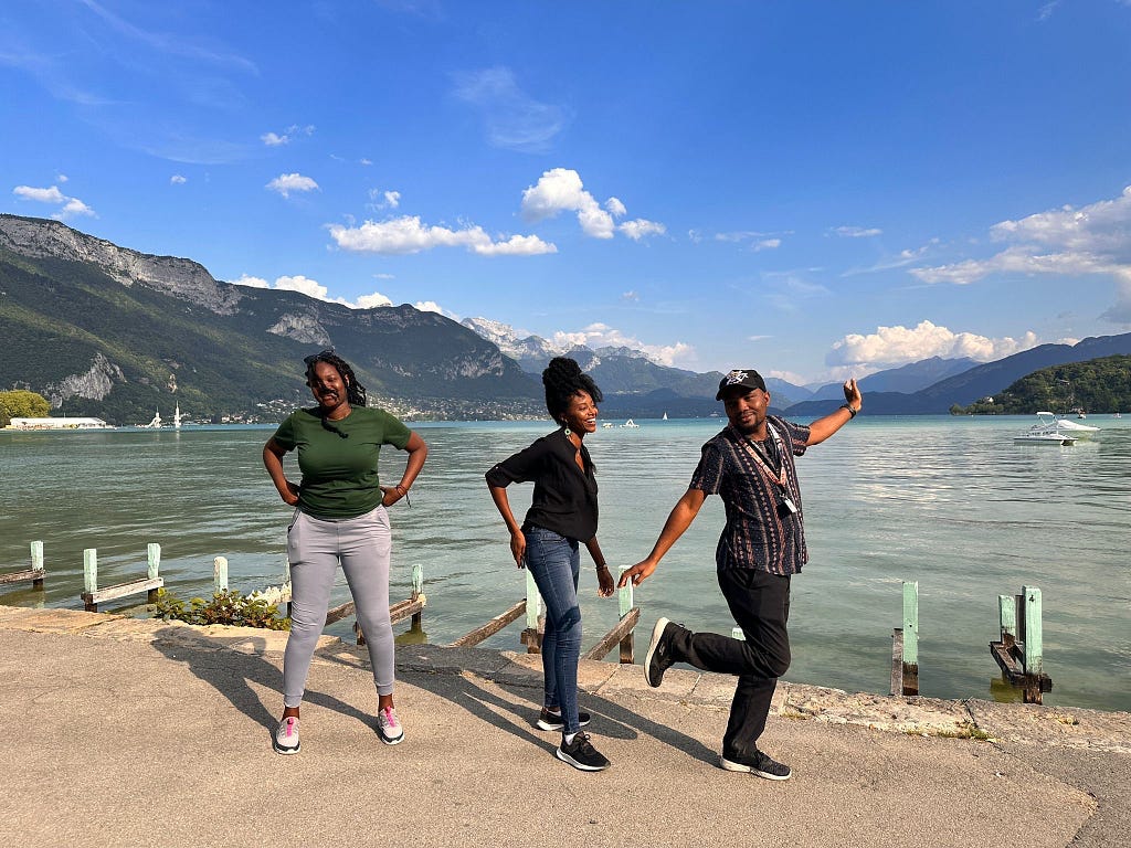 The ListenMi team members pose awkwardly by the Annecy Lake