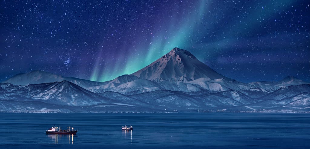 Polar lights emerging behind mountain, 2 boats in front.