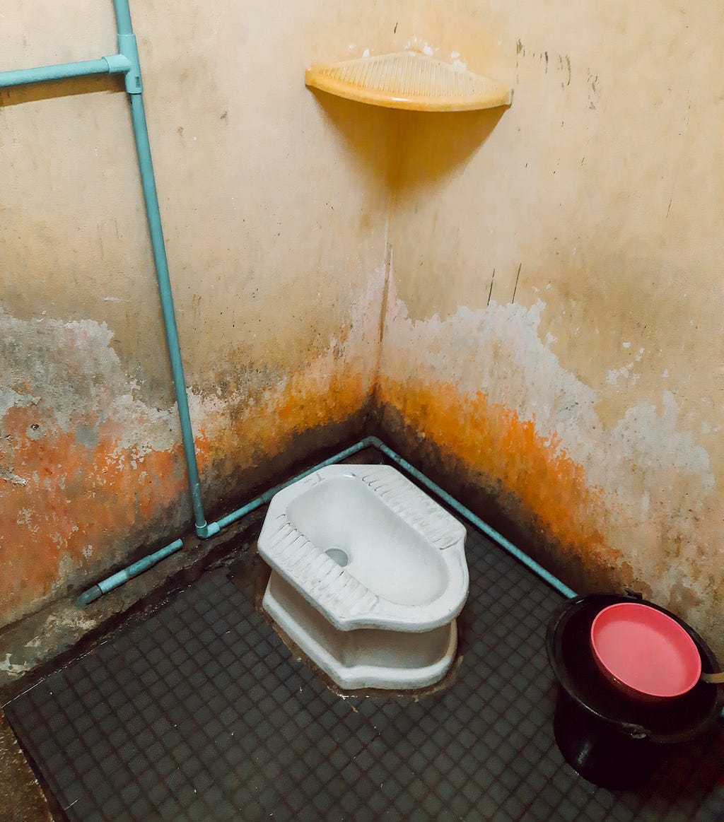 A photo of a traditional toilet in Southeast Asia