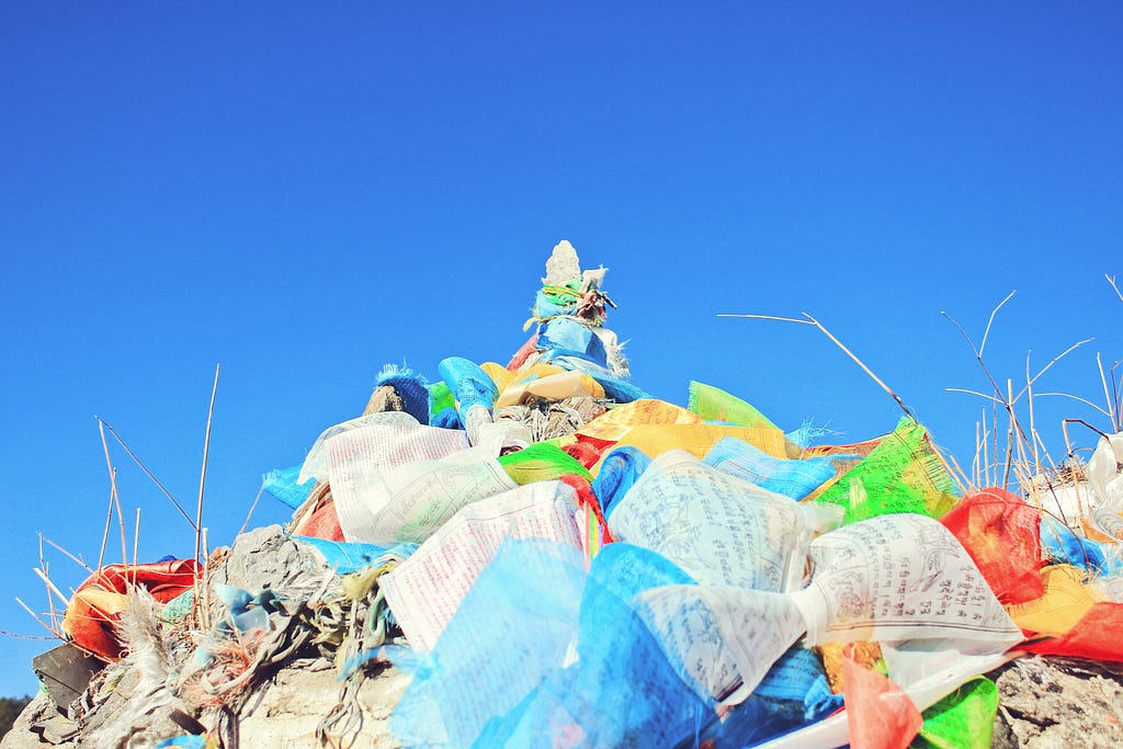 A pile of colorful plastic bags representing plastic pollution.