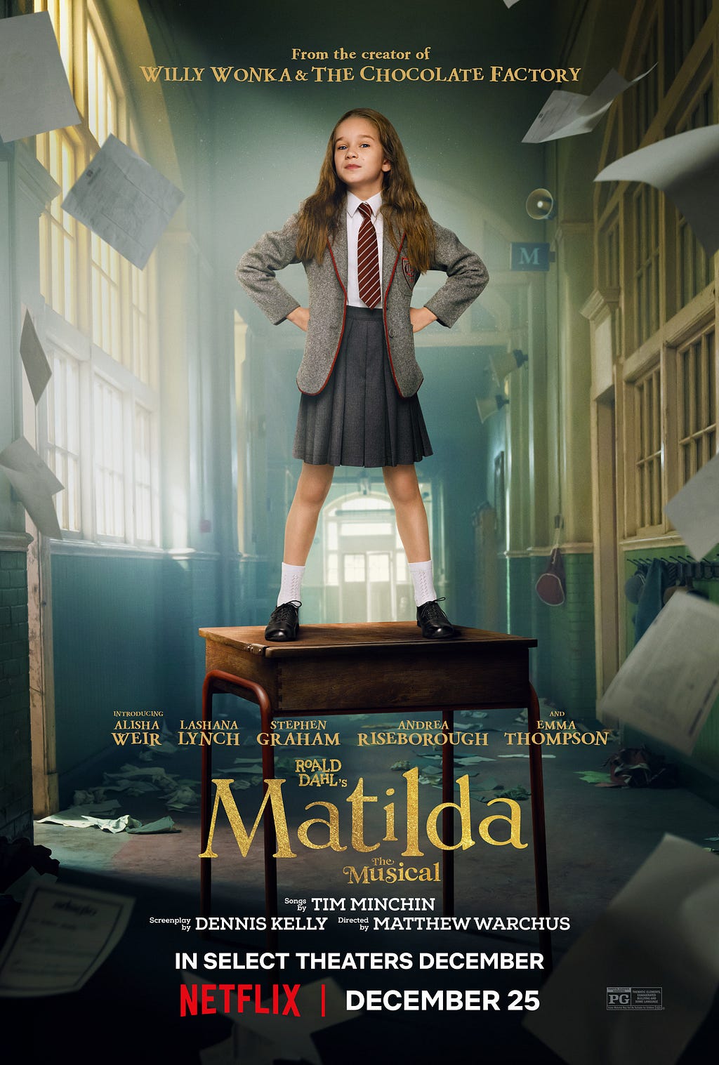 Matilda stands on a desk in a hallway wearing her school uniform. Papers fly around her.