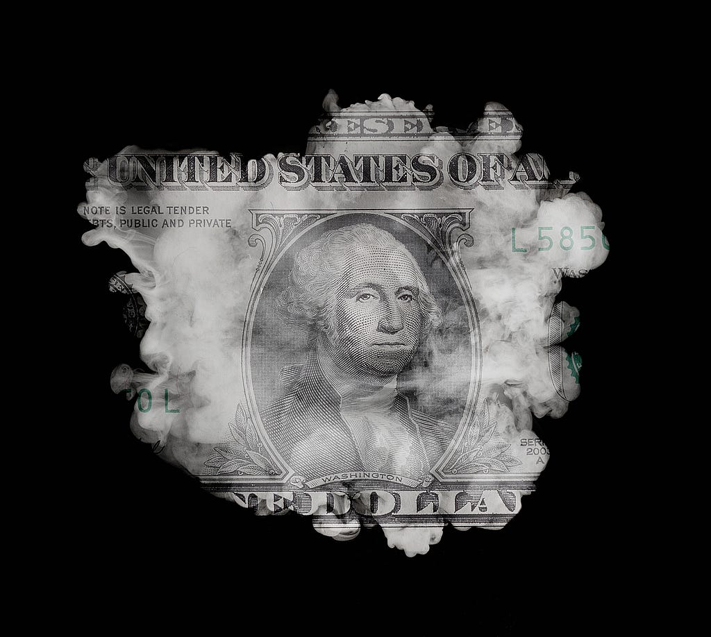 A cloud on a black background is superimposed over a US dollar bill.