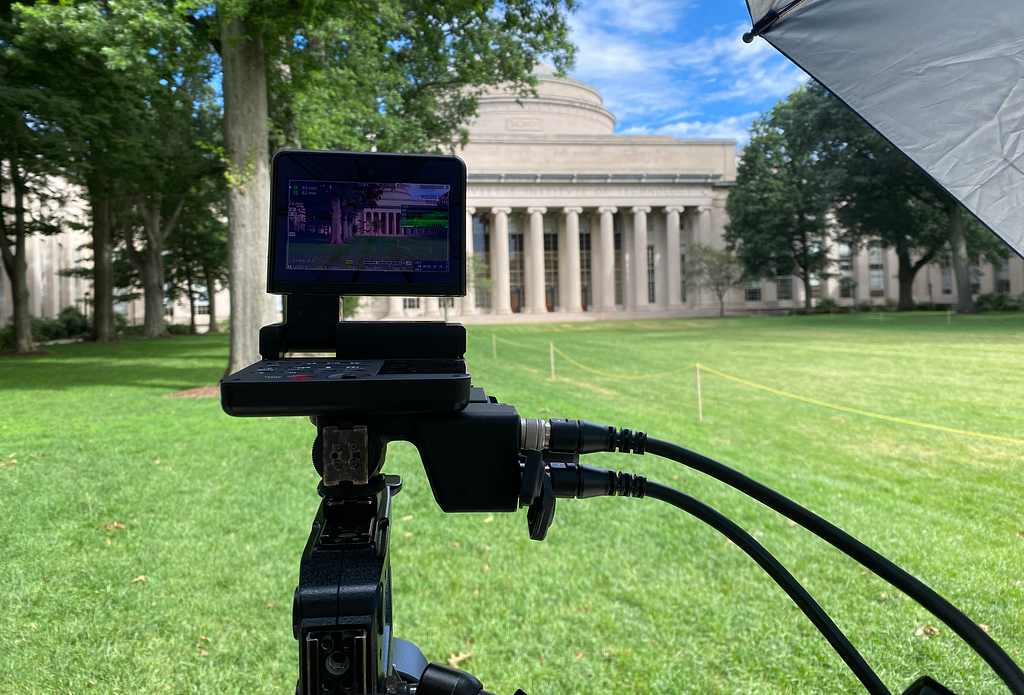 Photo of a video camera on the lawn in front of MIT’s Great Dome.