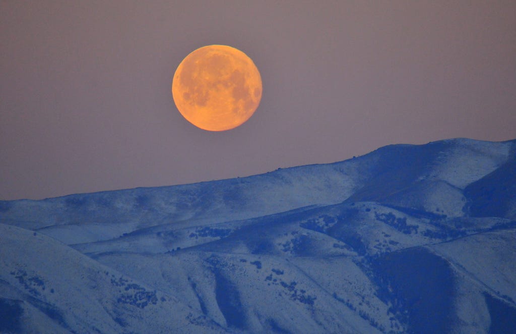 Moon setting over Bear River Migratory Bird Refuge, Utah.