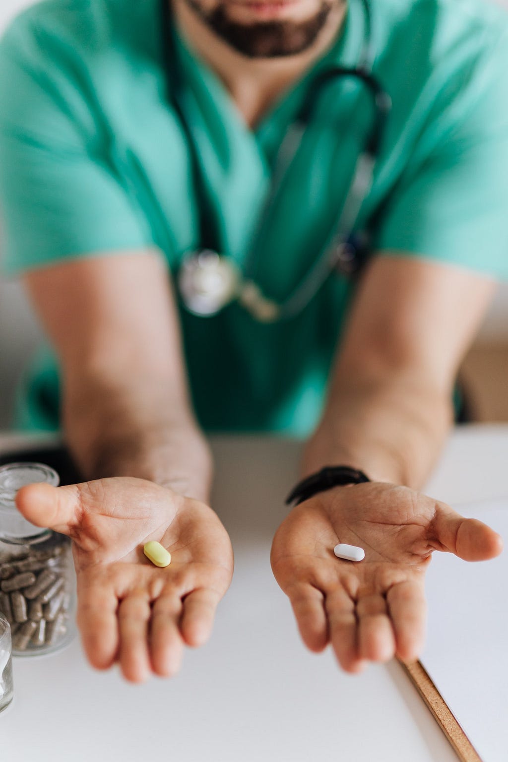 MWC Reentry image of a doctor with two pills.