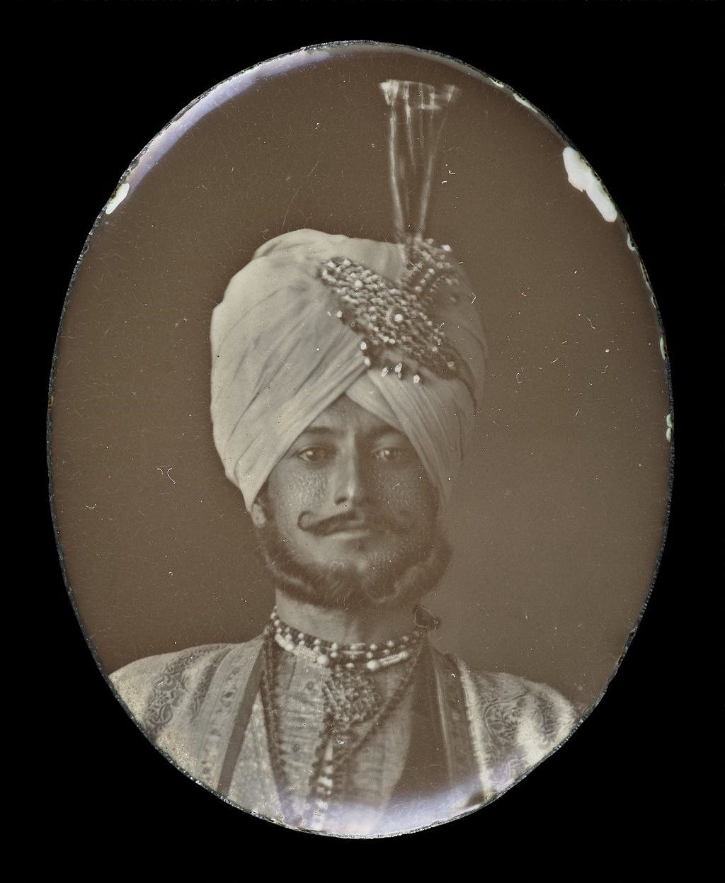 A portrait on enamel of of a young Indian gentleman.