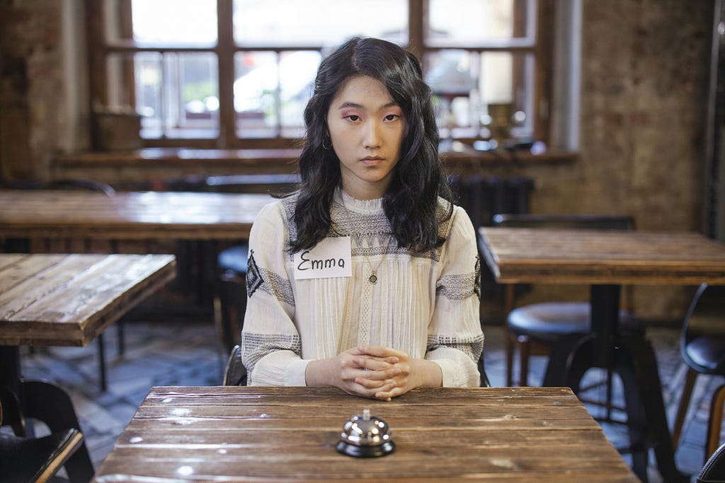 Woman sitting at a table for speed dating