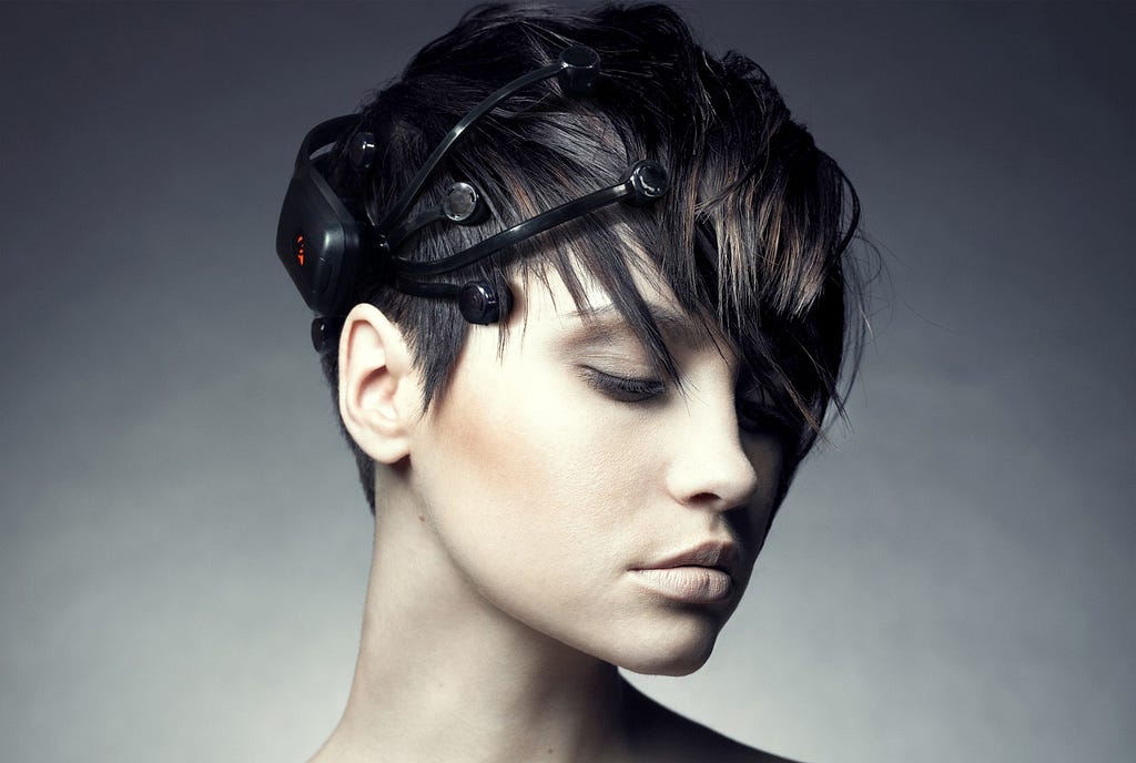 Woman wearing an EEG sensor headset