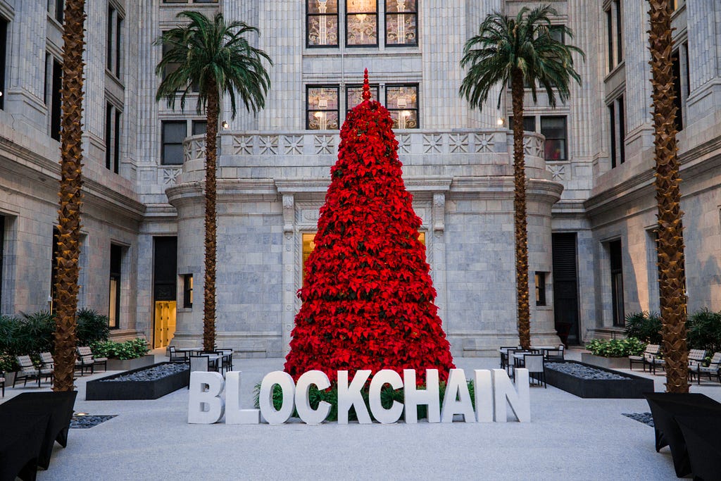 Blockchain words in front of tree at 2018 Milwaukee Blockchain Conference