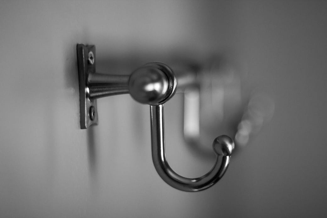 A hook on a wall representing the opening hook of an essay