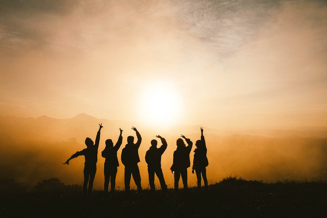 Group of friends posing with peace sign 