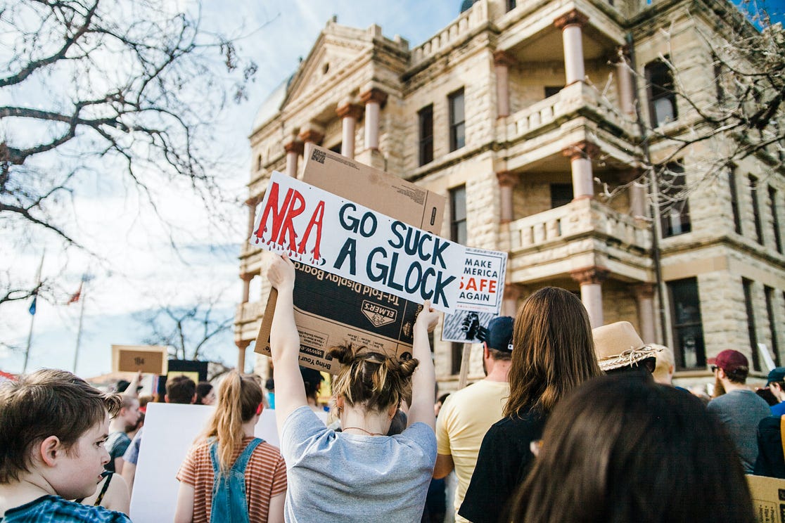 A photo of protestors at an anti-NRA rally
