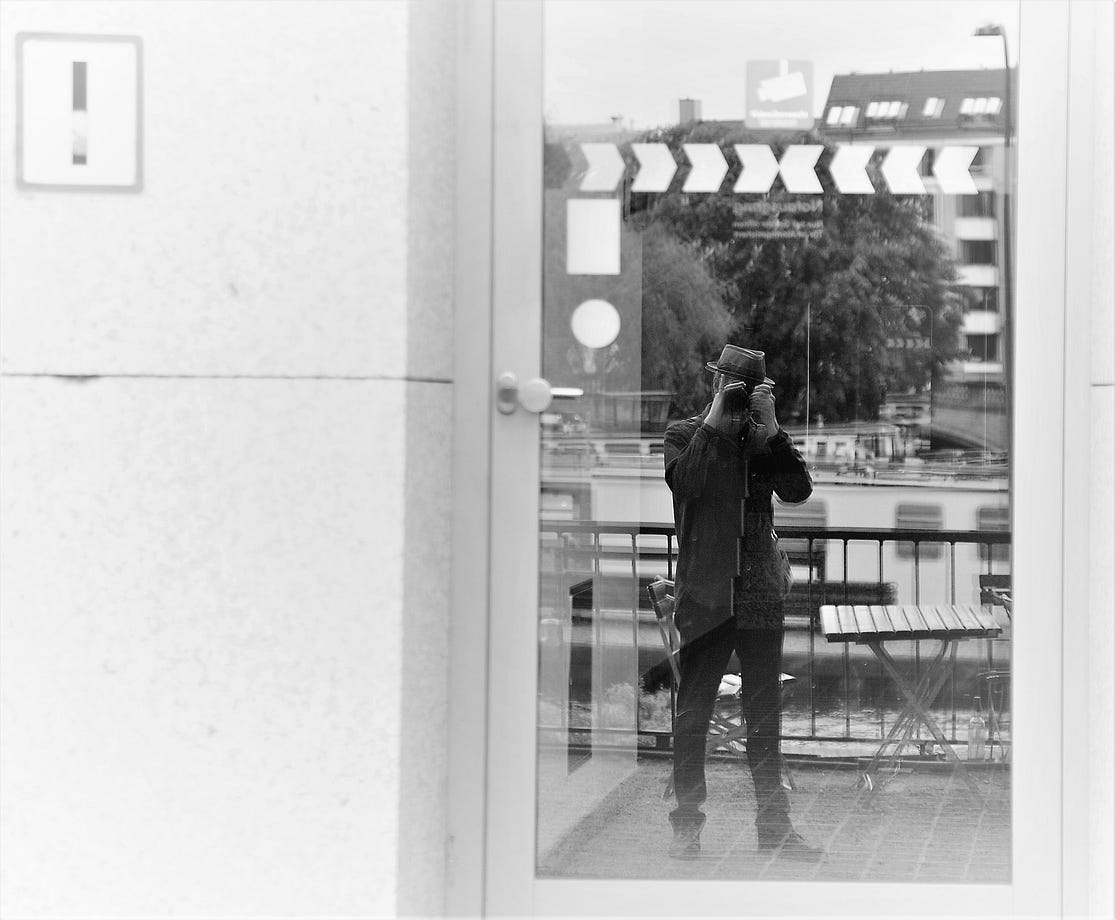 Self portrait in reflection of doorway. Copyright; Sean P. Durham, Berlin, 2022