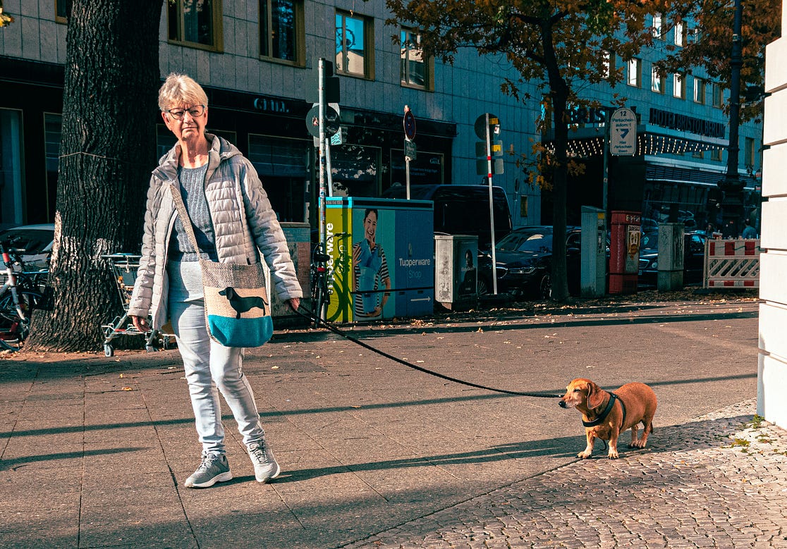 Woman walking her Dachshund in Charlottenburg, Berlin. Copyright; Sean P. Durham, Berlin, 2022